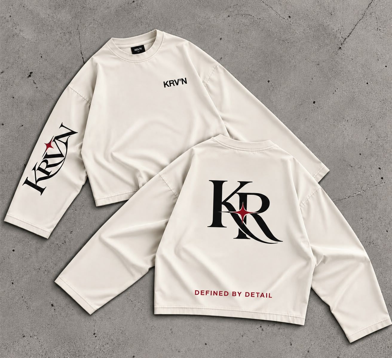 Krav'en KR Jumper in Ecru, front and back, laid flat on concrete: the KR monogram in black with a red star across the back, KRV'N in script down the sleeve.